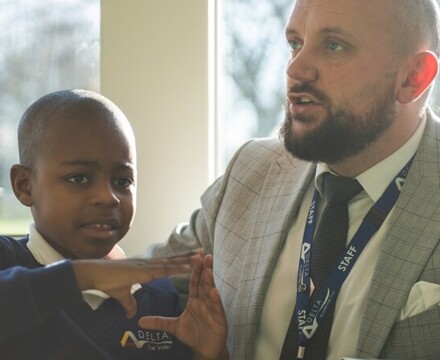 teacher and student reading together